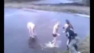 Drunk Russian tries to jump in a frozen lake